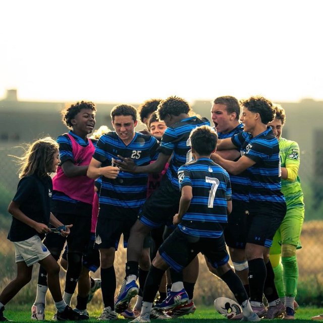 Development Academy players celebrating together