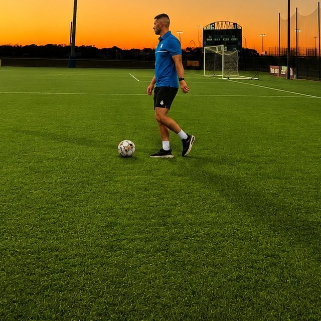 Connor MacDonald on the field at sunset